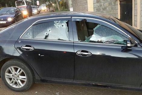 A salon car riddled with bullet holes.